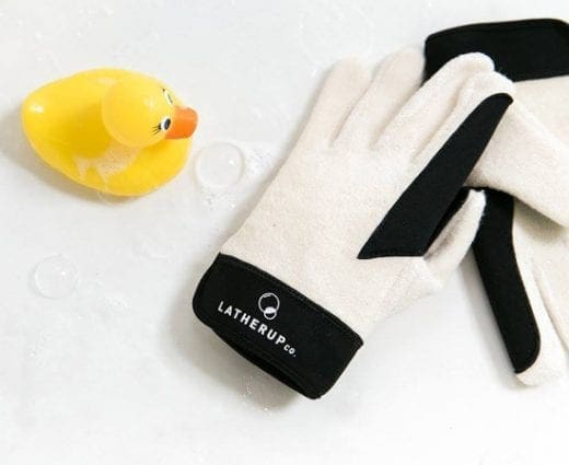 Pair of white Lathermitts with black trim next to a yellow rubber duck.