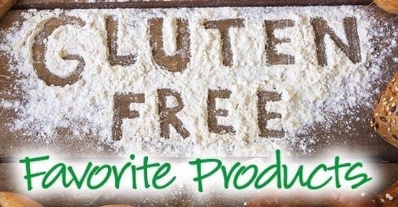 Gluten Free Favorite Products spelled out in flour on a wooden surface.