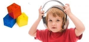 Child with headphones and building blocks