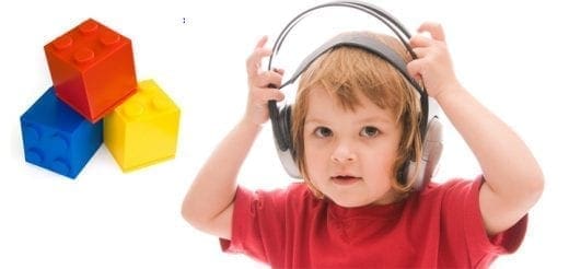 Child with headphones and building blocks