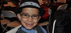 Joey wearing glasses and a hat.