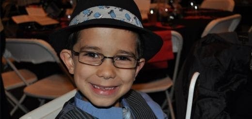 Joey wearing glasses and a hat.
