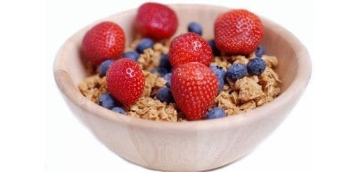 Bowl of cereal with strawberries and blueberries