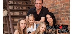 Jennifer Schwertfeger with her family on stairs.