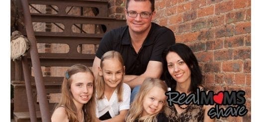 Jennifer Schwertfeger with her family on stairs.