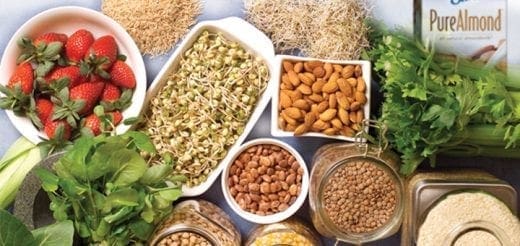 Assortment of gluten-free and casein-free foods including strawberries, sprouts, almonds, lentils, and almond milk.