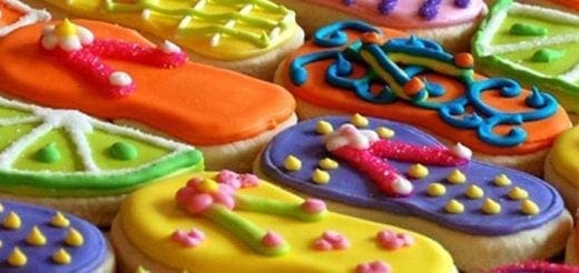 Colorful iced cookies decorated to look like flip-flops and lime slices.