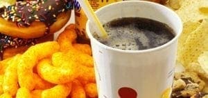 Donuts, cheese puffs, a soda, and chips