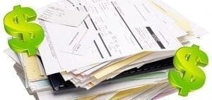 Stack of bills with dollar signs