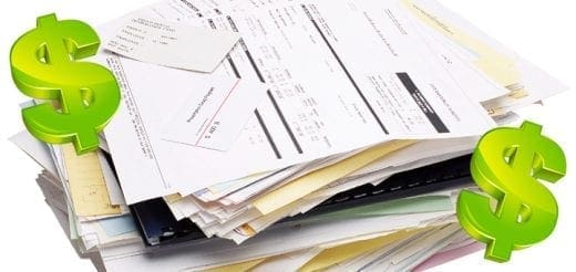 Stack of bills with dollar signs