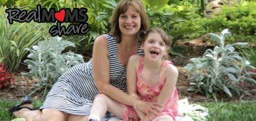 Geri Booth and her daughter Taylor sitting together in a garden.