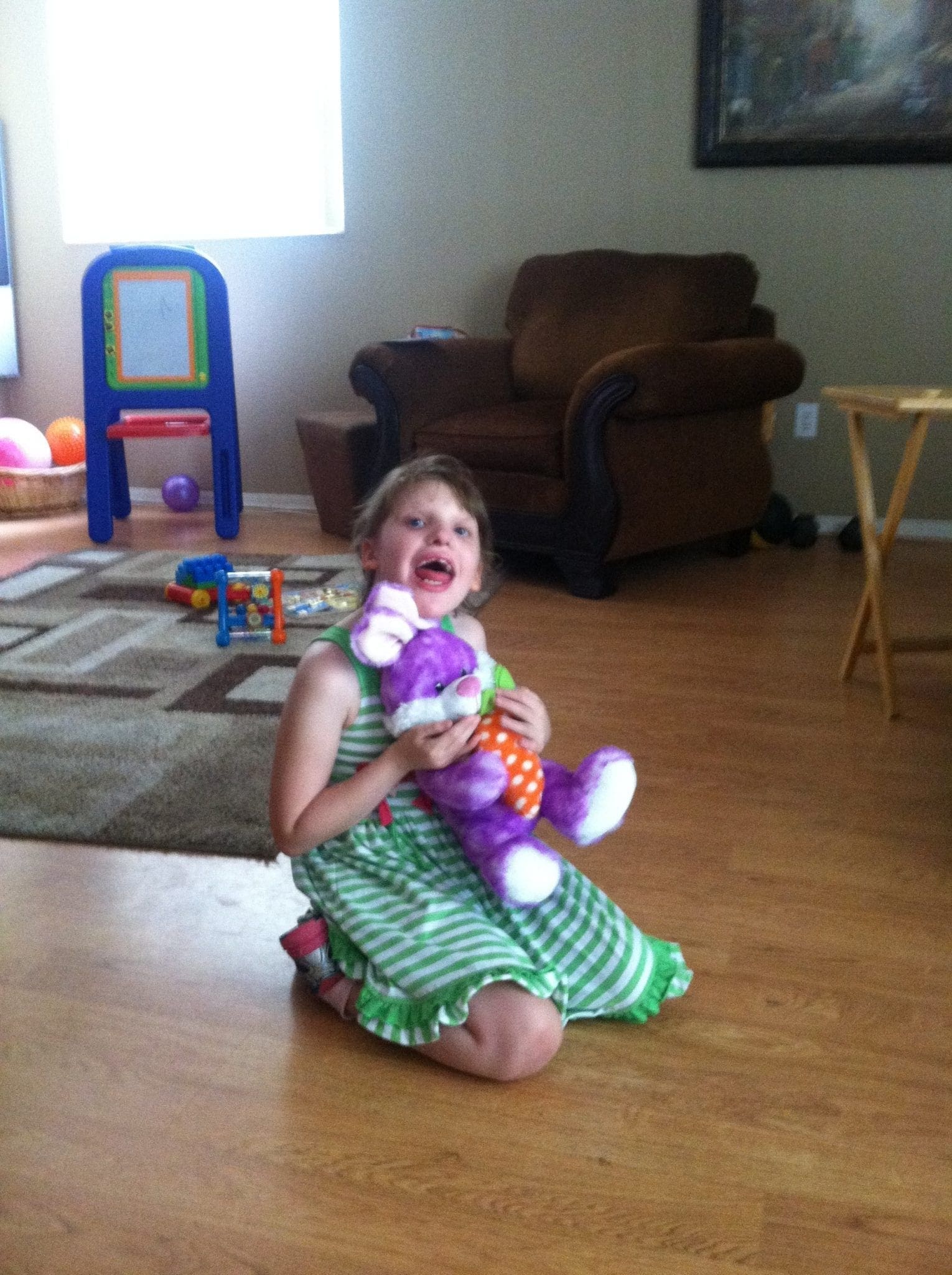 Geri Booth's daughter, Tay, holding a stuffed bunny.