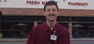 Bob smiling in front of a Raley's grocery store.