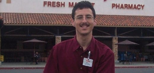 Bob smiling in front of a Raley's grocery store.