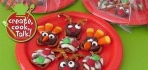 Holiday pretzel treats shaped like turkeys on a red plate.