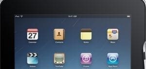 iPad showing the home screen with app icons.