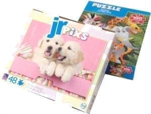 Boxes of Jr. Pixs and Puzzle brand jigsaw puzzles.