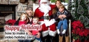 Family poses with Santa Claus in front of a fireplace and Christmas tree.