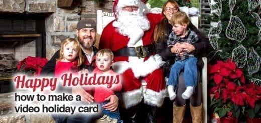 Family poses with Santa Claus in front of a fireplace and Christmas tree.