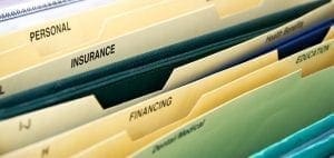 File folders labeled "Personal," "Insurance," and "Financing.