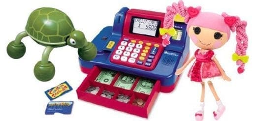 A toy cash register with a turtle toy and a doll.