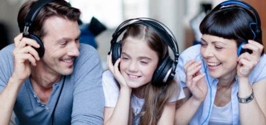 Family wearing headphones and listening together.