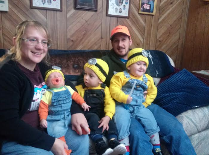 Tracy Felix with her husband and three children dressed as Minions.