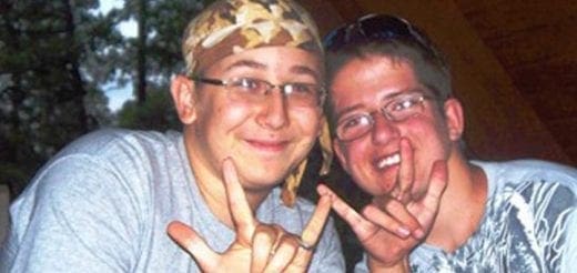 Two friends smiling and making hand gestures.
