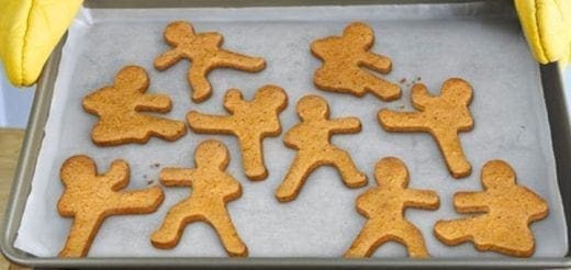 Ninjabread men cookies arranged on a baking sheet