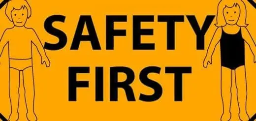 Children figures on either side of the words "SAFETY FIRST