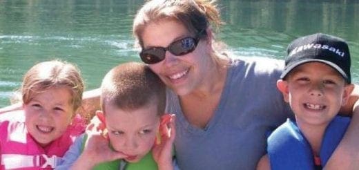 Dani Wykes with three children on a boat.