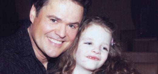 Mallory Reynolds smiling with Donny Osmond