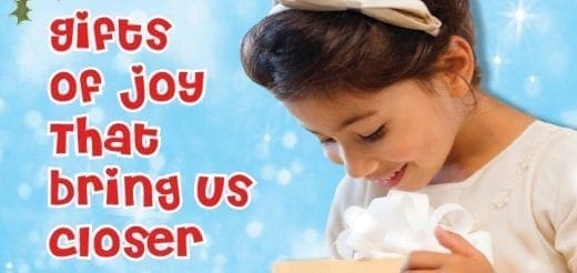 Child looking down at a gift against a blue, snowy background with the text Gifts of Joy That Bring Us Closer.