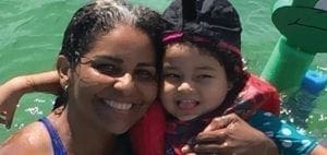 Ivanna Fajardo and Neysha Miranda smiling in the water.
