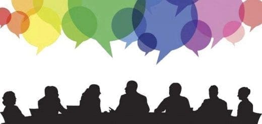 Silhouettes of people at a table with colorful speech bubbles above them.