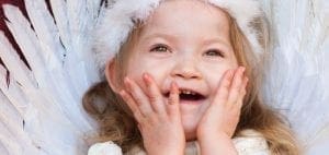 Savannah Rose Richardson smiling with her hands on her face.