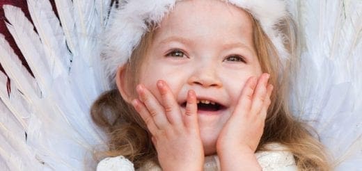 Savannah Rose Richardson smiling with her hands on her face.