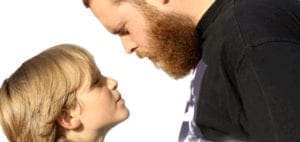 Man and child face each other in profile.