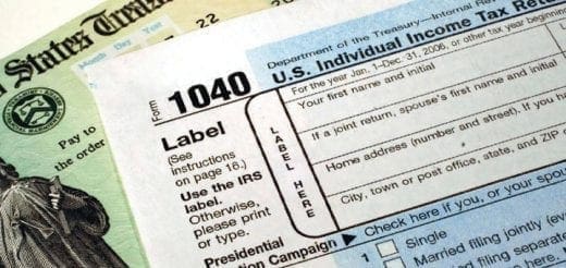 U.S. individual income tax form 1040 and a U.S. Treasury check.