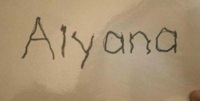 Aiyana handwritten on a light background.