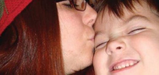 Courtney Barnum kisses Liam on the cheek.