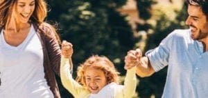Family with a child outdoors, celebrating