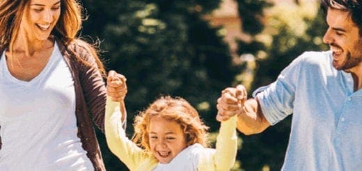 Family with a child outdoors, celebrating