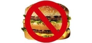 Double cheeseburger with a red prohibition sign over it.