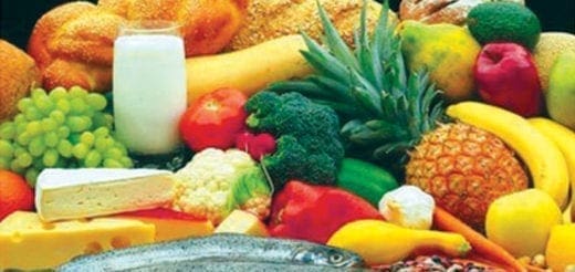 Assortment of fresh fruits, vegetables, dairy, fish, and bread.