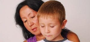 Mother and son looking down.