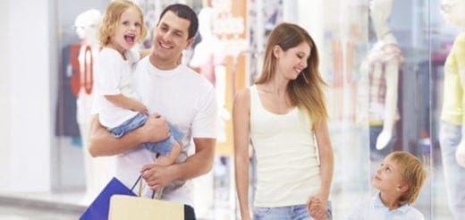 Family shopping for clothes at a store.