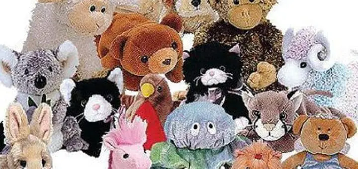 Collection of assorted stuffed animals including a koala, cat, and bear.