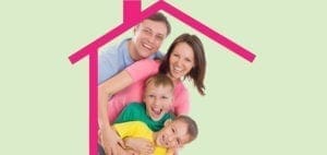 Family smiling under a pink house outline on a green background