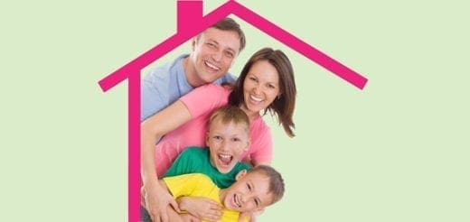 Family smiling under a pink house outline on a green background
